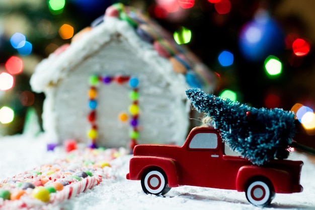 Close-up of gingerbread house with christmas decorations at home