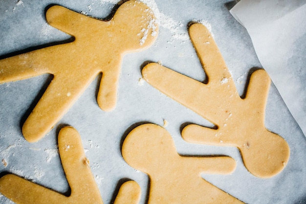 Close up of gingerbread men on wax paper