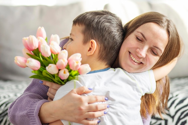 Close-up of girl blowing flowers