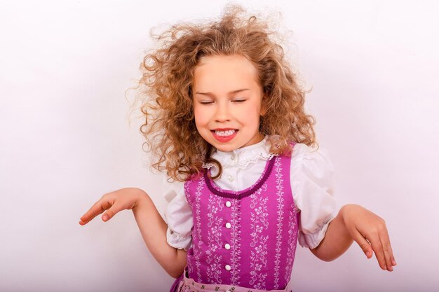 Close-up of girl dancing against wall