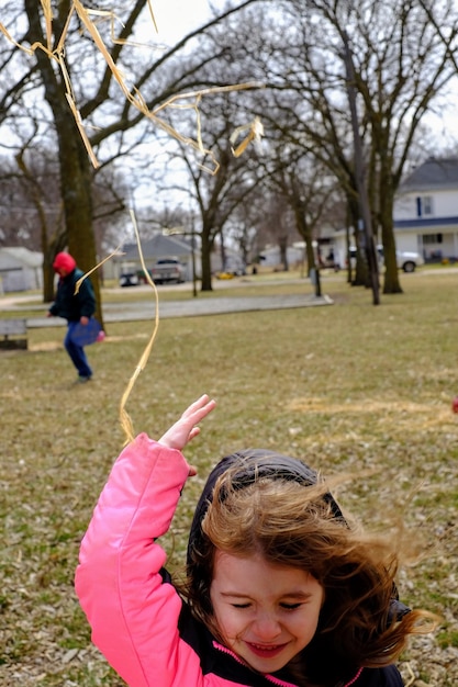 Photo close-up of girl playing on field