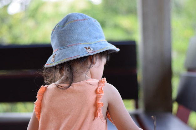 Close-up of girl wearing hat