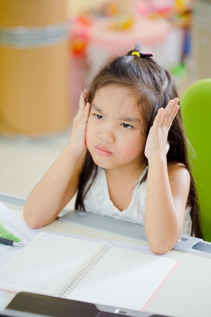 close-up of girl writing at home