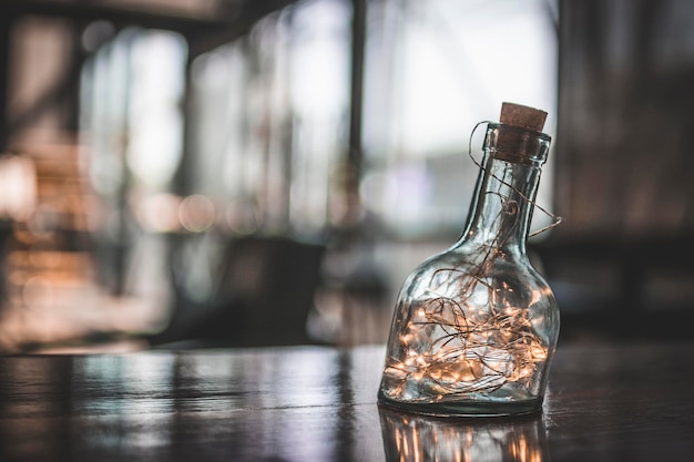 Close-up of glass bottle on table