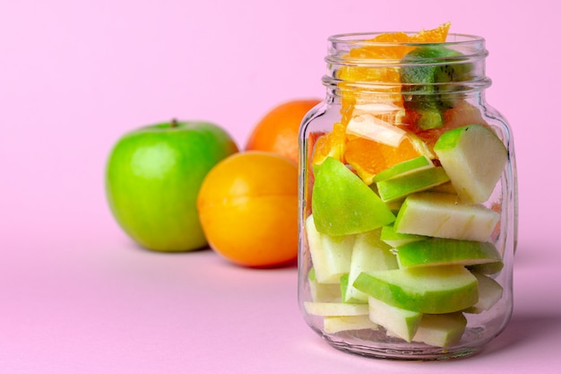 Close up on glass bowl with fresh fruit pieces