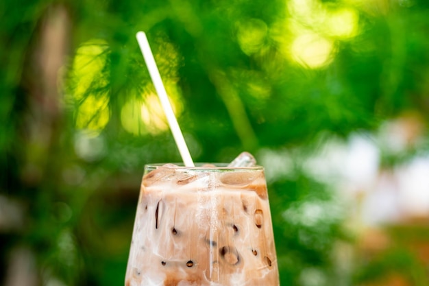 Close up of a glass of Iced Cocoa cool drink served on table Iced chocolate drink