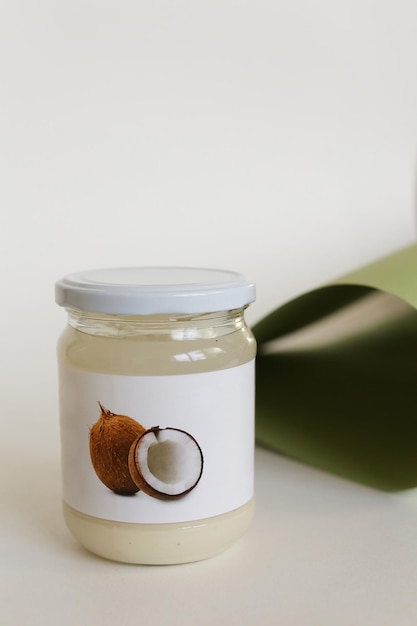 close-up of glass jar on table against white background