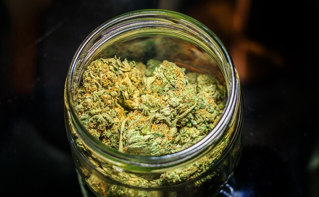 Close-up of glass jar on table