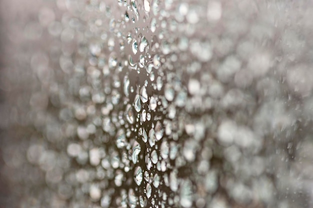 A close up of a glass with water droplets on it