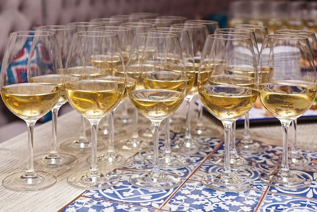 Close-up the glasses of the champagne on a table