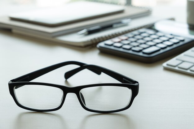 Close up of glasses and computer business workplace work place in office