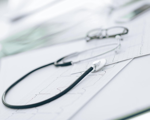 Close up glasses and a stethoscope on the therapist39s Desk