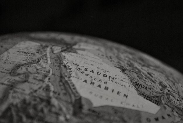 Photo close-up of globe against black background