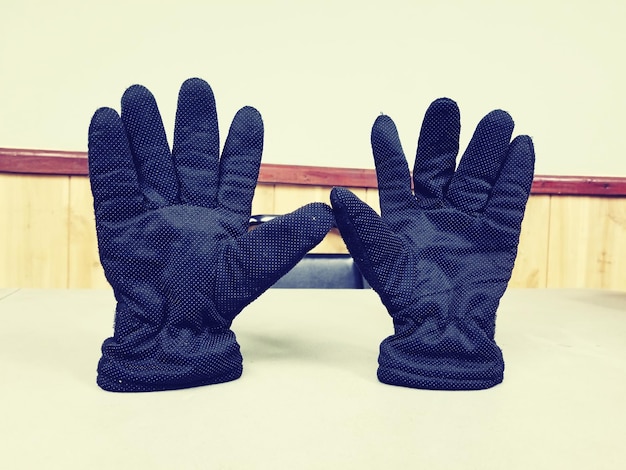 Close-up of gloves on table