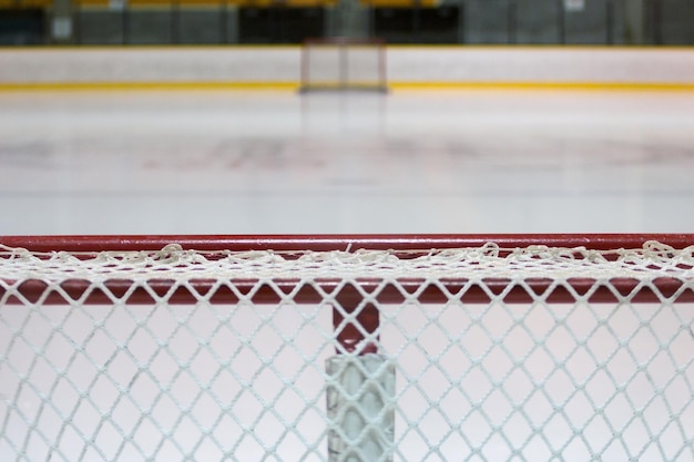 Photo close-up of goal post at ice hockey rink