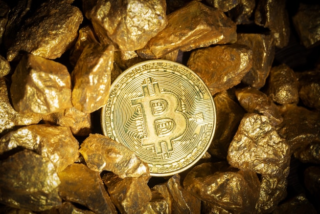 Close up of gold bullion and bitcoin, concept of financial\
cryptocurrency