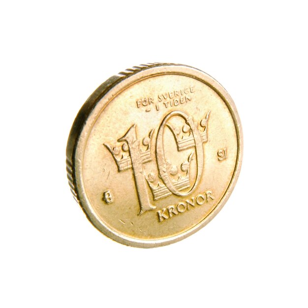 白い背景の金貨のクローズアップ