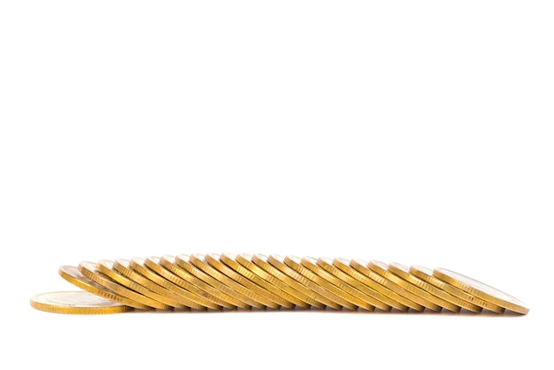 Photo close-up of golden coins over white background