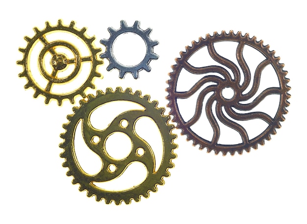 Photo close-up of golden gears over white background