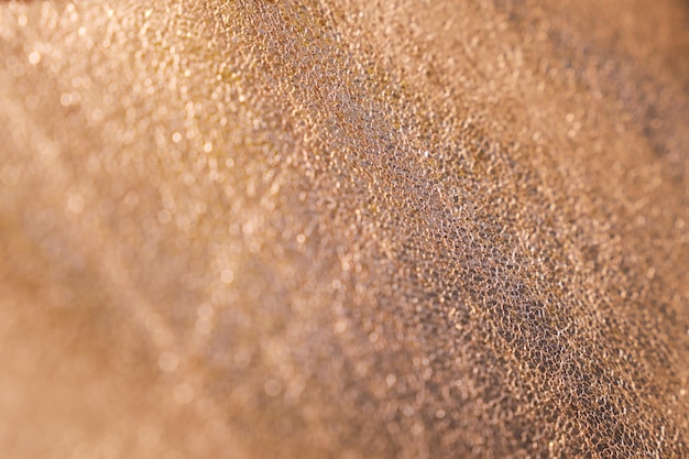 Close up of golden glitter textured background