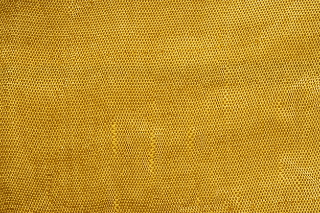 Photo close up of golden silk fabric texture