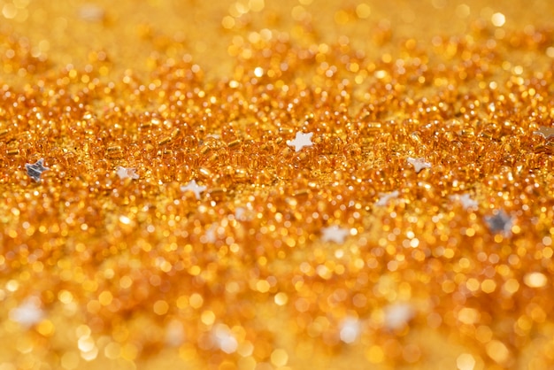 Photo close up on golden sparks and glitter