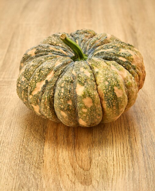 Close-up of gourds on wooden table