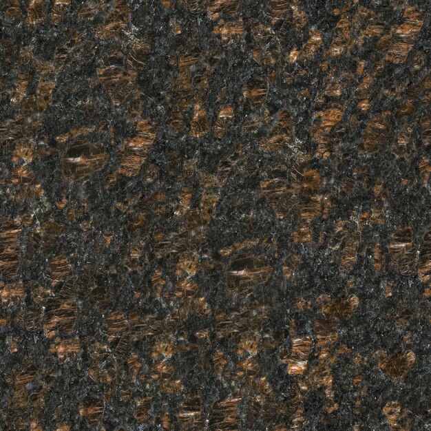 A close up of a granite surface with the word rock on it.