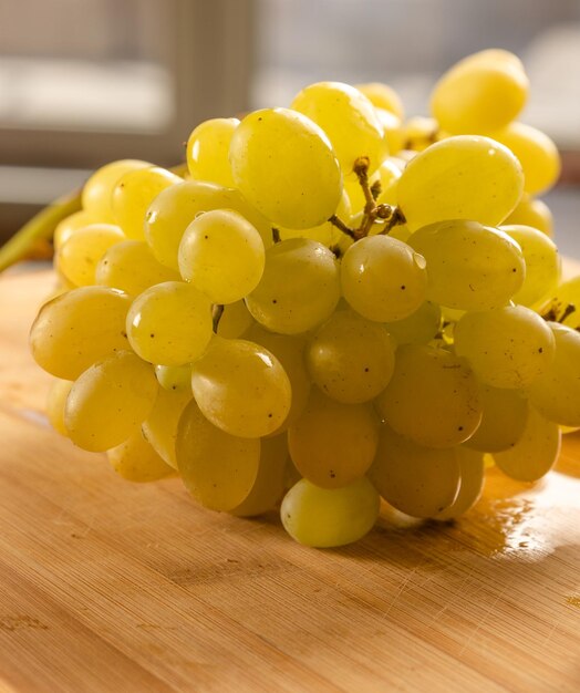 Close-up of grapes on table