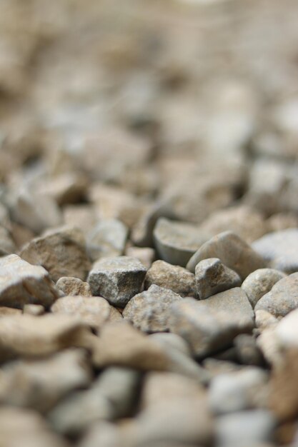 Foto chiuda in su pietre grigie ciottoli sfondo astratto texture rocce materiale da costruzione