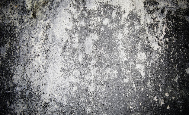 Photo a close up of a gray wall with white paint and stains.