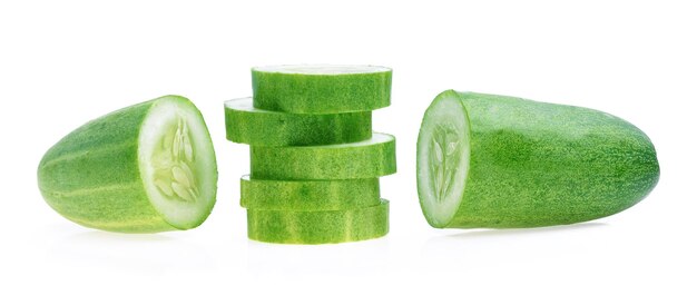 Photo close-up of green cucumbers against white background