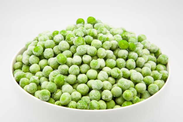 Close-up of green fruits against white background