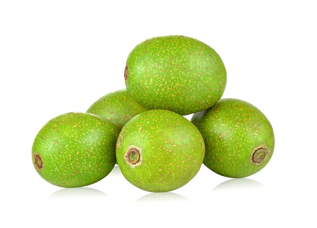 Photo close-up of green fruits against white background