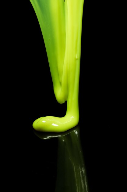 Close-up of green leaf against black background