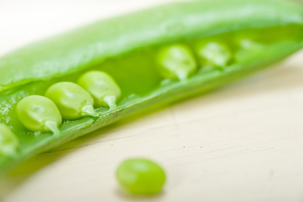 Close-up of green peas on table