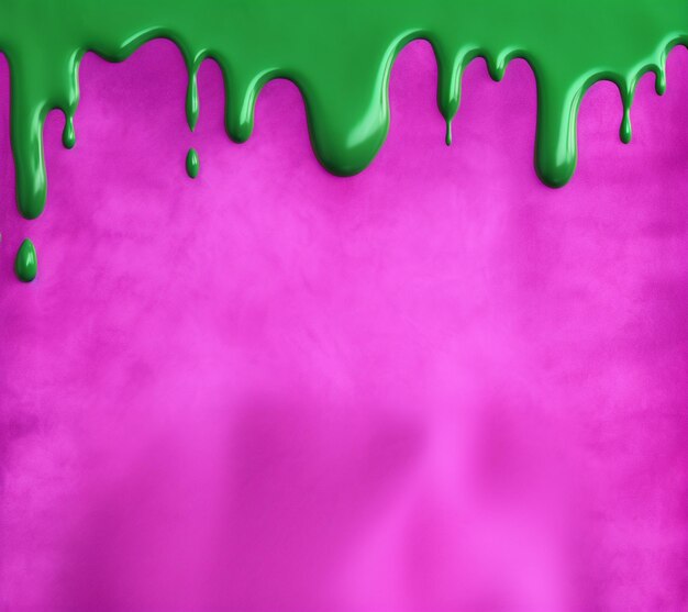 Foto un primo piano di una superficie coperta da liquido verde e rosa generativa ai