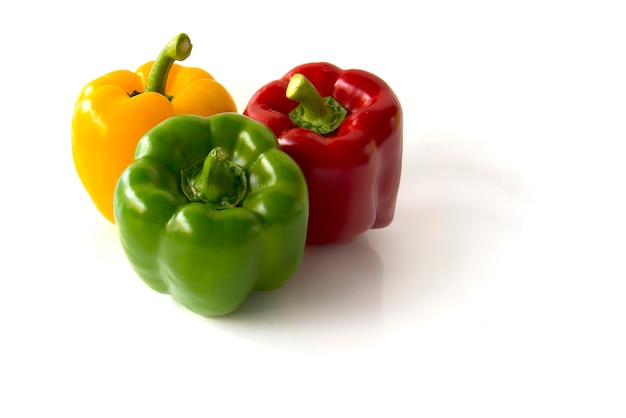 Close up Green and red Yellow bell peppers isolated on white background