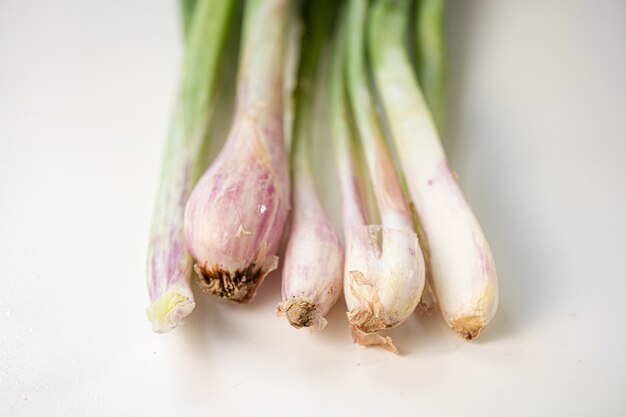 Close up of green scallion onion on white background. Healthy food. Farmer life