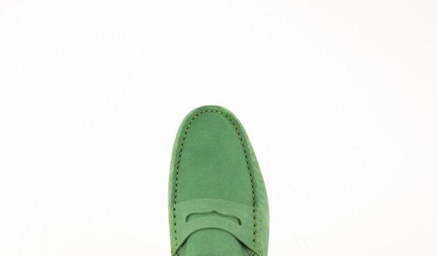 Close-up of green shoe on white background