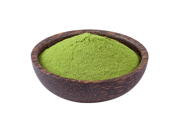 Close-up of green slices in bowl against white background