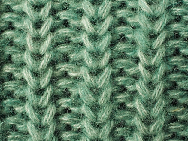 A close up of the green stitching of the stitching.