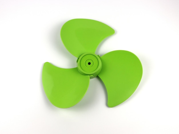 Close-up of green toy over white background