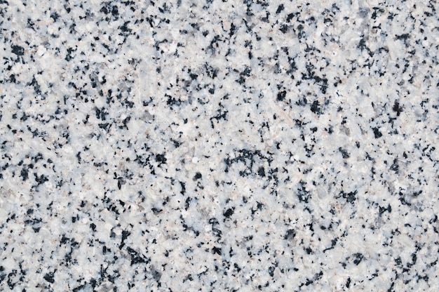 Primo piano di sfondo con texture in pietra di granito grigio