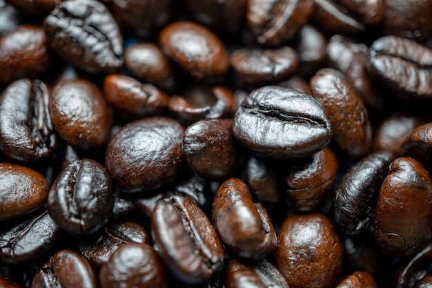 Close up of group black coffee beans. Strong black espresso