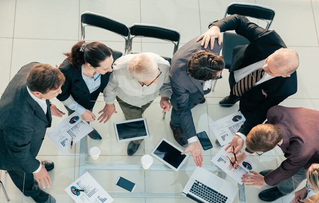 Close up. group of employees discussing the financial report