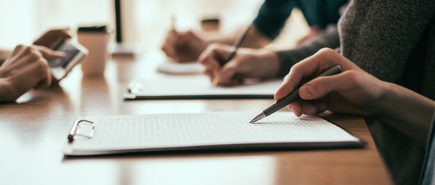 Close up. a group of employees works with business documents. business concept.