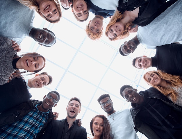 Close up. group of young people standing in a circle