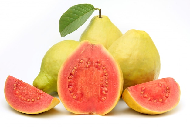 Photo close-up guava fruit, pink, fresh, organic, with leaves, whole and sliced, isolated on white background. front view