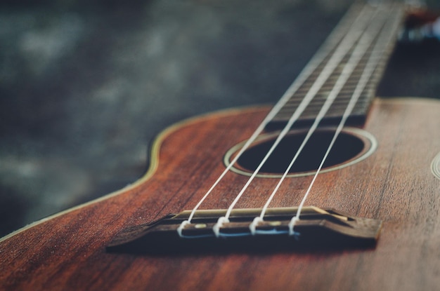 Close-up of guitar on table